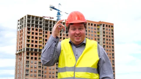 Male builder foreman, worker or architect on construction building site showing Stock Footage 111879931