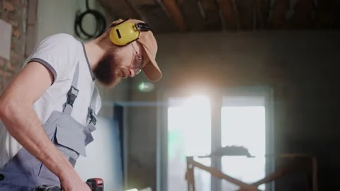 Male builder using electrical screwdriver in construction studio 스톡 동영상 170502082