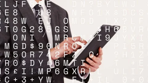 Male business exec tapping tablet, reviewing data with text overlay drifting Stock Footage 332956070