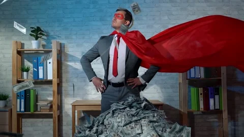 Male businessman in superhero costume flying banknotes Stock Footage
