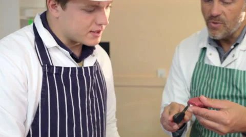 Male Butcher Showing Teaching Apprentice Stock-Footage 40431793