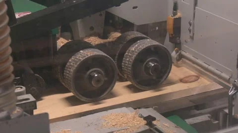 A male carpenter works in a carpentry workshop on a thickness gauge Stock Footage 328457401
