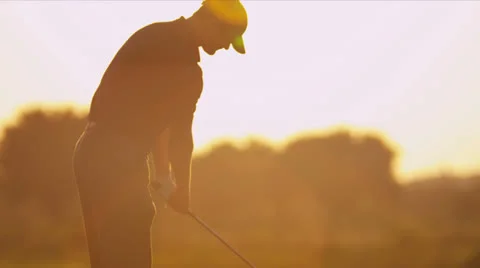 Male Caucasian Golfer Practicing Swing Silhouette Stock Footage