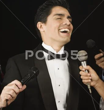 Male celebrity laughing for the press Stock Photos