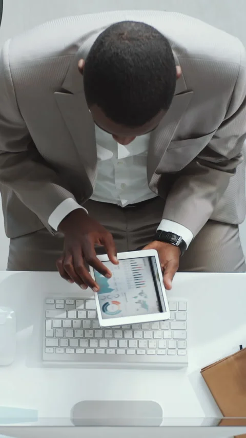 Male CEO Checking Business Data Using Digital Tablet at Work Desk Stock Footage 284450628