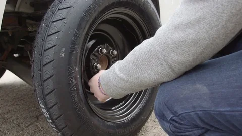 Male Changing Flat Tire On Side Of Road - Putting On Spare Vídeo Stock 74903669