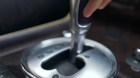 Male changing gear by moving gearshift in luxury car, automatic transmission 스톡 동영상 80942055