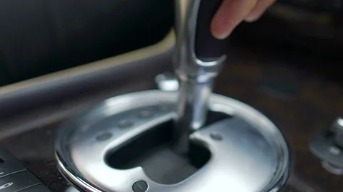 Male changing gear by moving gearshift in luxury car, automatic transmission 스톡 동영상 80948377