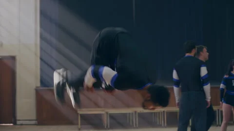 A male Cheerleader doing a backflip Stock Footage 279766992