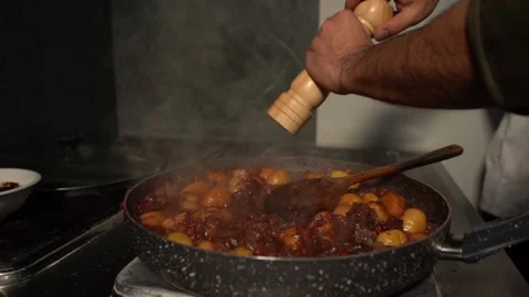 Male Chef Adding Salt, Pepper And Spices To Meal. Wooden Pepper Stock Footage 234078828