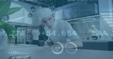 Male chef inspecting kitchen counter, reaching for sprayer and wiping as Stock Footage 331593321