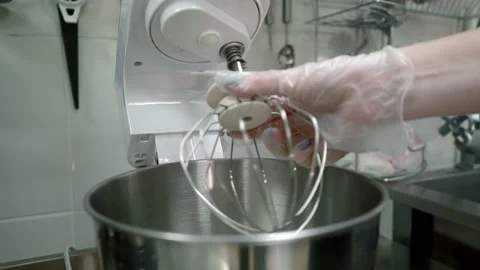 Male chef mixes ingredients, using blender in kitchen indoors. Stock Footage 86858424