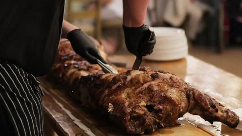 Male chef prepares meat with crispy crust and spices baked on grill in kitchen Stock Footage 196006043