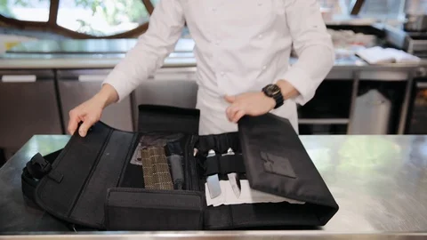 Male chef preparing his professional cooking knives at restaurant. Man's hands Stock Footage 129458404