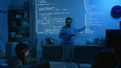 Male Coding Teacher Explaining Algorithm to Schoolkids in Blue Projector Light Stock-Footage 306980344