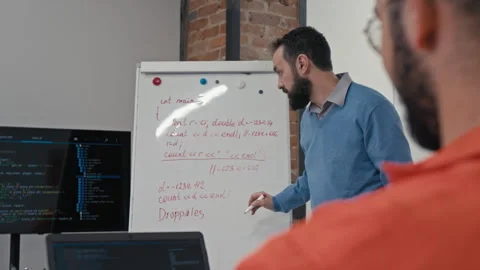 Male Coding Teacher Talking to Inmate while Conducting Lesson in Jail Video stock 314053720