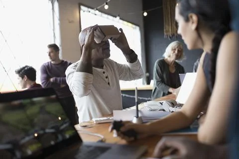 Male computer programmer testing and programming virtual reality simulator glass Foto stock