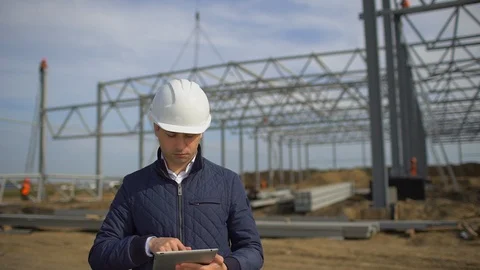 Male construction engineer architect supervisor in hard hats working checking Stock Footage 98368377