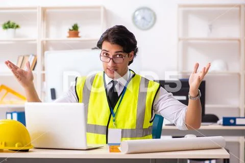 Male construction engineer working in the office Stock Photos