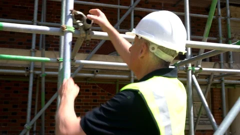 Male Construction Worker Checking Scaffolding on Site Stock Footage 105721262
