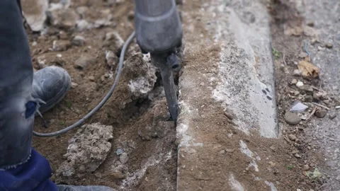Male construction worker using a jackhammer on construction site Stock Footage 319884218
