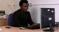 Male is content as he streches then continues with work HD Footage