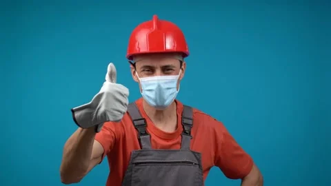 Male contractor gesturing thumb up during pandemic Stock Footage 188183963