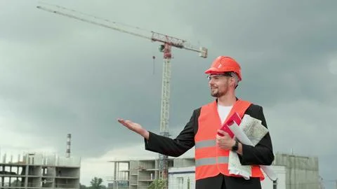 Male controlling work process on construction site, working Stock Photos