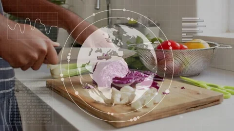 Male cook chopping cabbage in kitchen, knife motion sparking globe HUD over Stock Footage 335480859