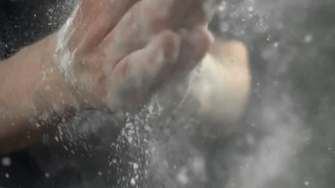 Male cook hands with flour, cooking in slow motion Stock Footage