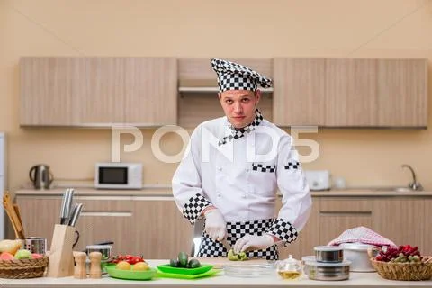 Male Cook Preparing Food In The Kitchen