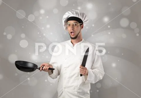 Male cook with shiny grey wallpaper Stock Photos