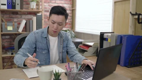 Male creative designer is taking note Stock Footage 154445886