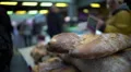 Male customer buying freshly baked bread at market, healthy lifestyle and food HD Footage