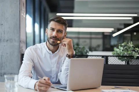 Male customer support operator with headset and smiling Stock Photos