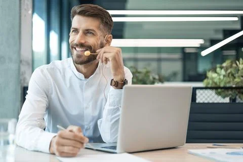 Male customer support operator with headset and smiling Stock Photos