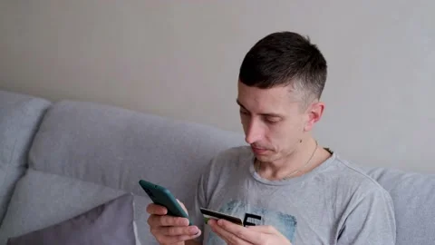 Male customer using e-banking app on smartphone. Stock Footage 149595243