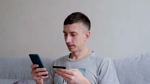 Male customer using e-banking app on smartphone. Stock Footage 149595357