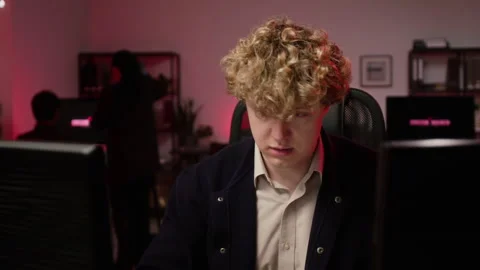 Male Cybersecurity Analyst Working on Computer during Cyberattack in Office Stock Footage 347294687