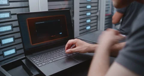 Male Cybersecurity Engineer Analyzing Critical Cyber Attack Warning in Data Stock Footage 344965593