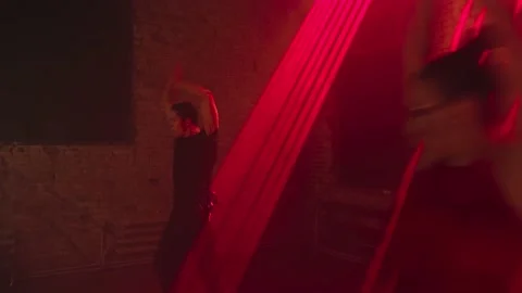 Male dancer in black clothes dancing,synchronous passionate movements.Latin Stock Footage 229318474