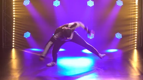 Male dancer dancing break dance, hip hop, street dancing in the studio, isolated Stock Footage 138914897
