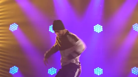 Male dancer dancing break dance, hip hop, street dancing in the studio, isolated Stock Footage 138915031