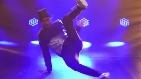 Male dancer dancing break dance, hip hop, street dancing in the studio, isolated Stock Footage 138917749
