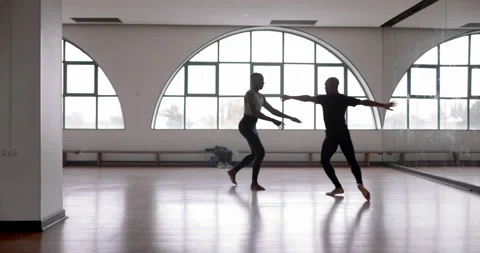 Male dancer lifting partner up while dancing in studio Stock Footage 147359511