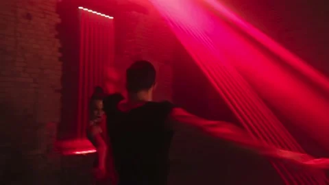 Male dancer moves close-up to camera, pirouettes backwards, engages his female Video stock 229318365