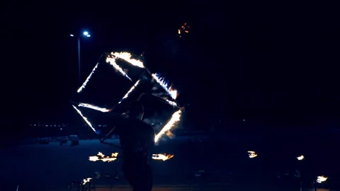 Male dancer performing a dance with burning cube. Stock Footage 257276625