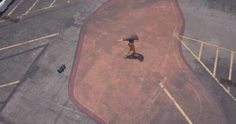 Male dancer performing his routine on top of a parking garage Vídeo Stock 97014691