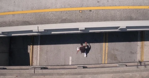Male dancer performing his routine under an overpass 스톡 동영상 97017705