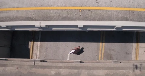 Male dancer performing his routine under an overpass Stock Footage 97018715